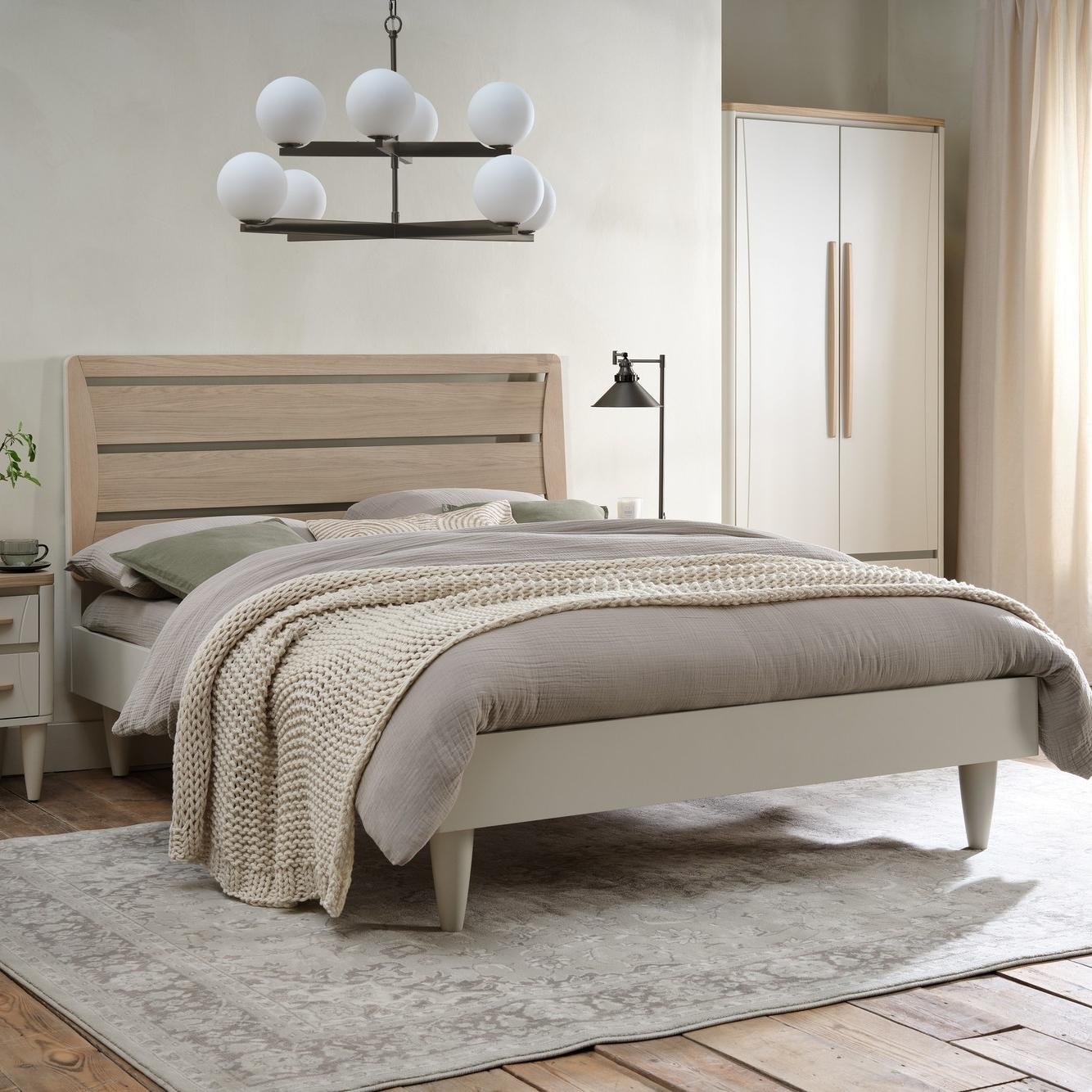 Sink into the calm and sleek simplicity of the Larsen Bedstead. Soft grey tones and Scandi oak detail...